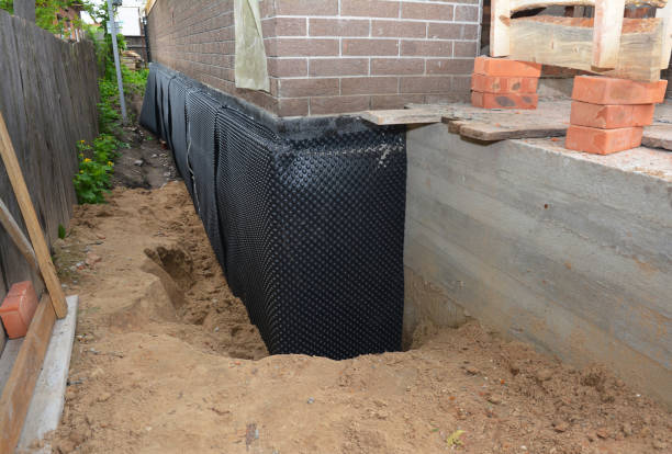 Happy homeowners after waterproofing job in Nesconset